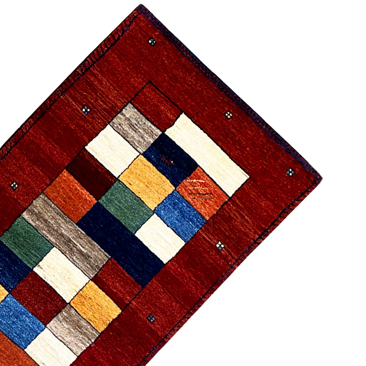 Red Gabbeh rug runner corner with a geometric central motif.