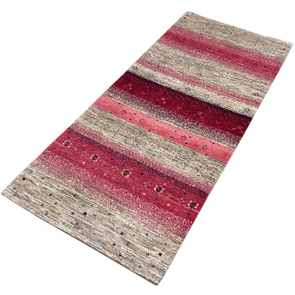 Gabbeh runner rug 190x80 cm viewed from above at an angle, striped design in pink and beige