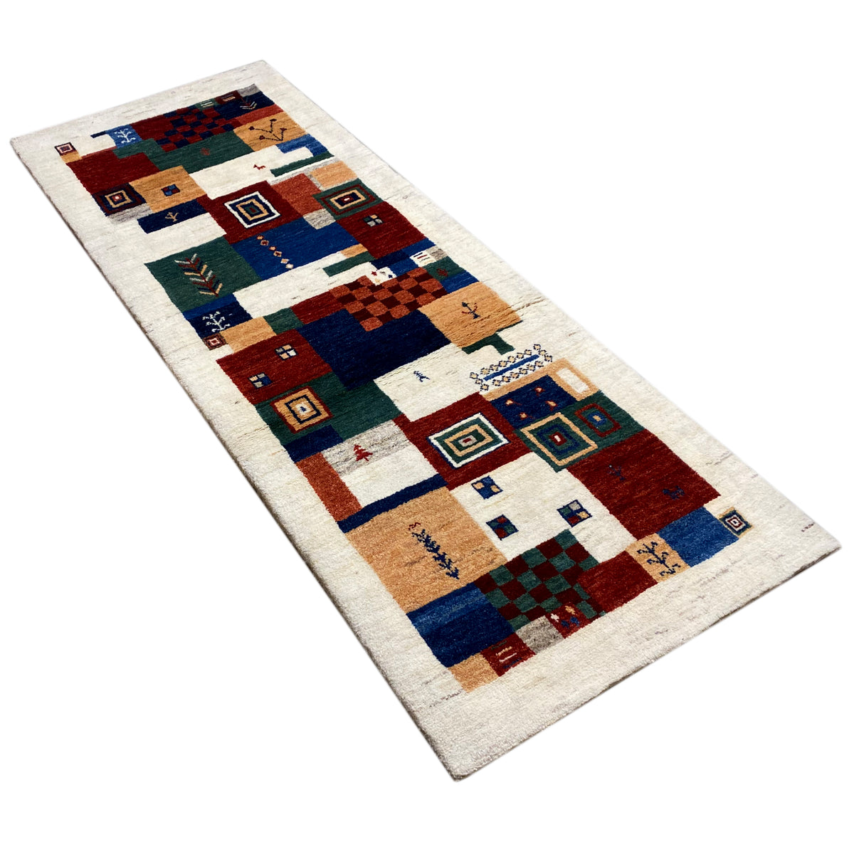 Gabbeh rug in a patchwork design with rectangles and diamonds in blue, red, and beige