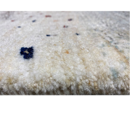 Close-up of the carpet surface: light fibers with a few dark blue accents