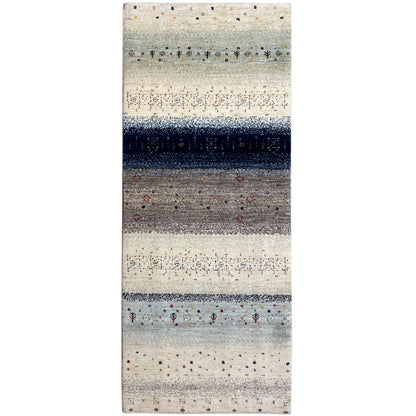 Gabbeh rug runner with a light beige field, dark blue central stripe, and dotted patterns