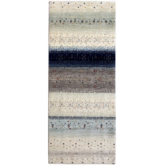 Gabbeh rug runner with a light beige field, dark blue central stripe, and dotted patterns