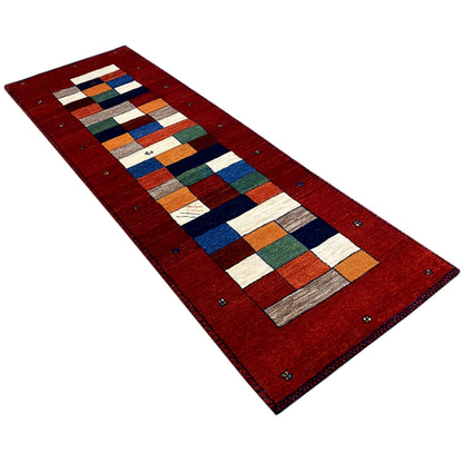 Red Gabbeh runner with a diagonally aligned patchwork pattern of colorful rectangles