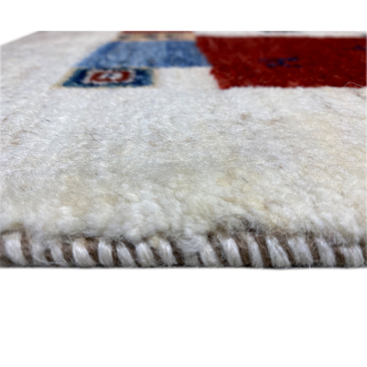 Gabbeh rug with fringed edge and fine woven texture, multicolored
