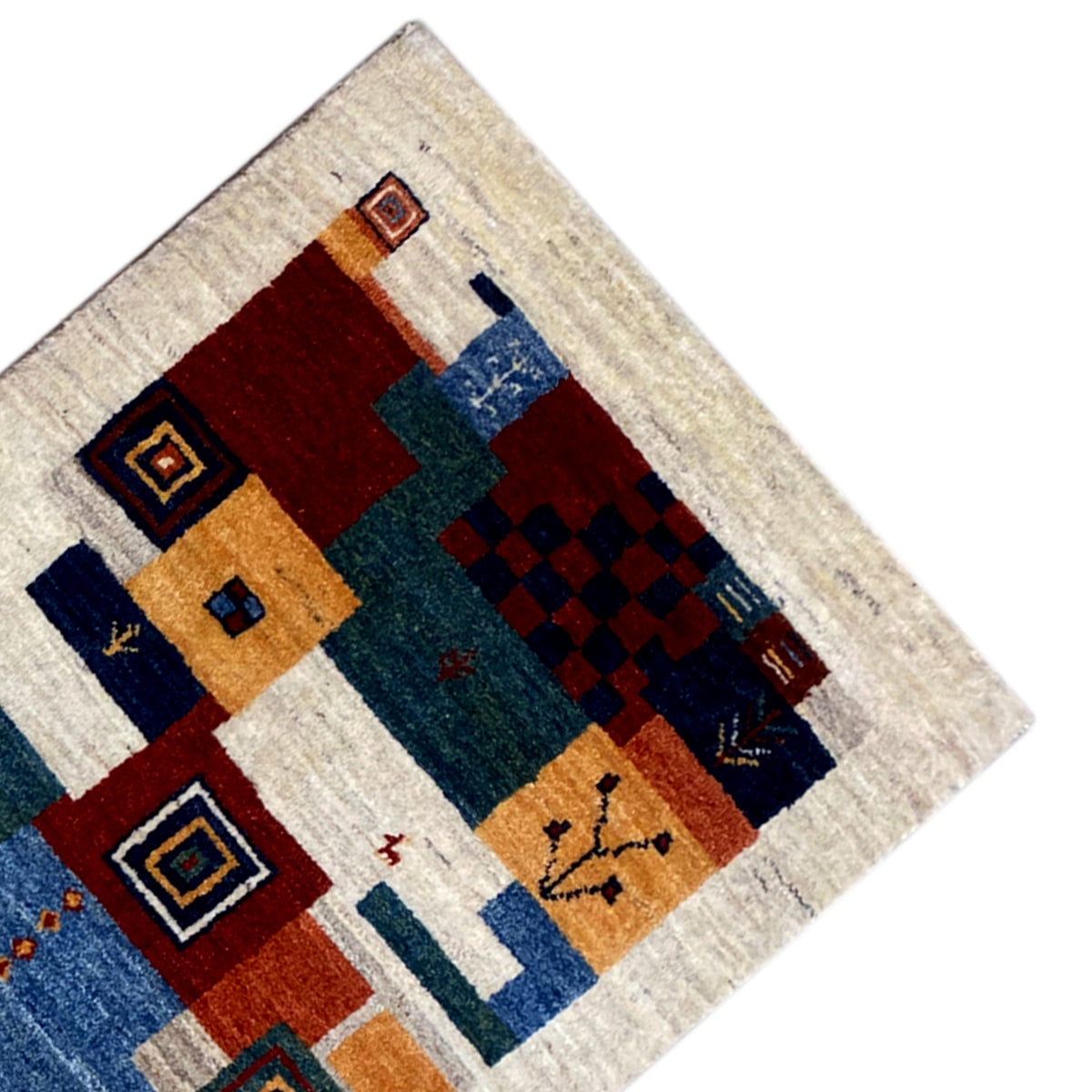 Gabbeh rug corner with multicolored squares and diamonds in a block pattern