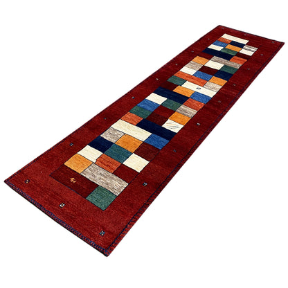 Long red Gabbeh runner rug with block pattern and colorful border