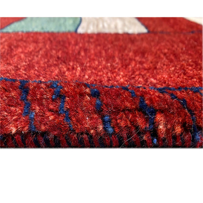 Textile detail: red pile with dark blue stripes in a block pattern