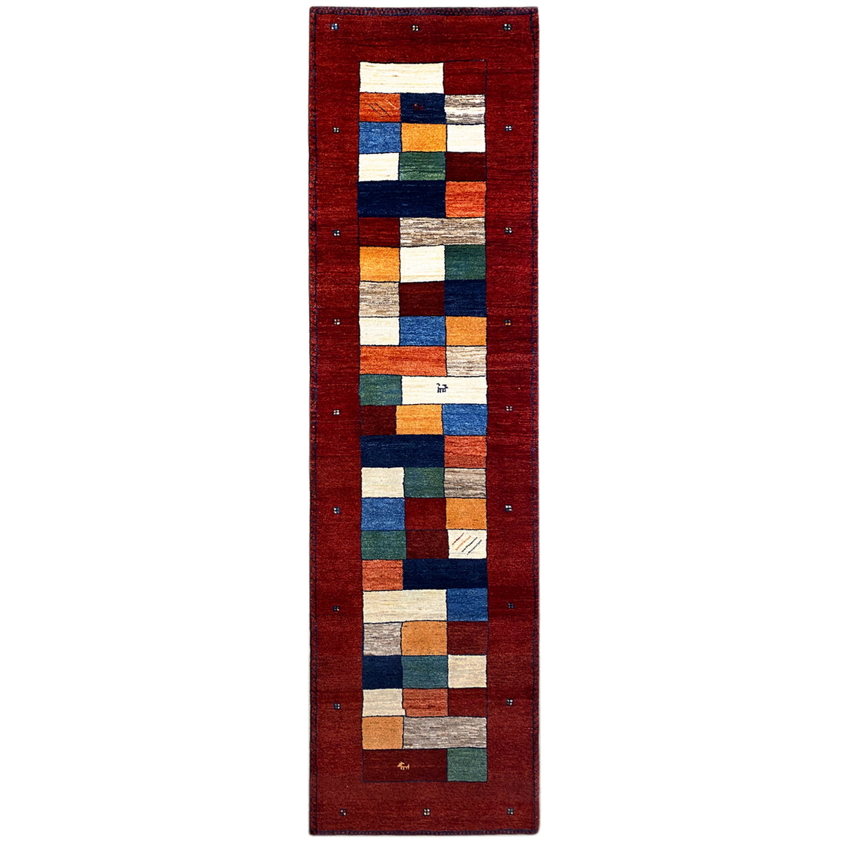 Red Gabbeh runner rug with a geometric patchwork pattern and border