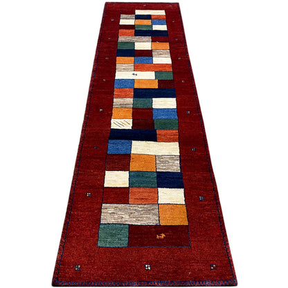 Long gabbeh runner: red background with geometric squares in blue, green, and orange