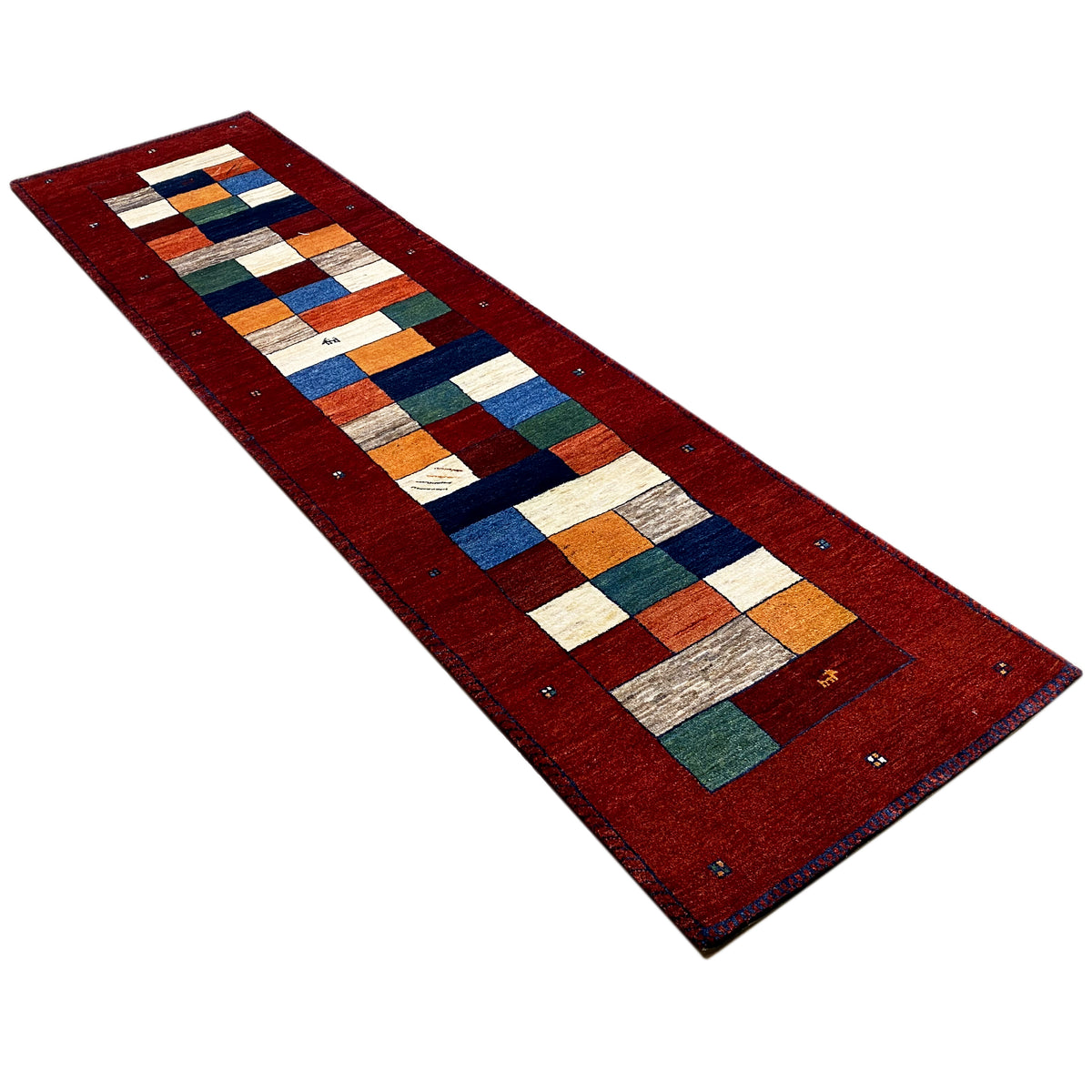 Gabbeh runner rug in a diagonal pattern: red background with multicolored rows of blocks