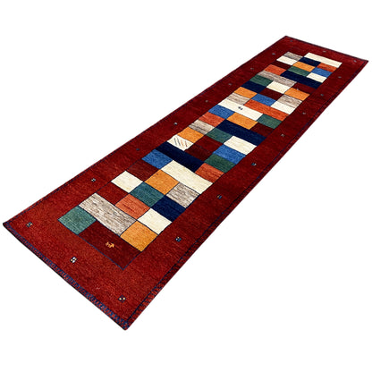 Gabbeh runner rug diagonal: red pile with a block pattern in white, blue, green, and orange