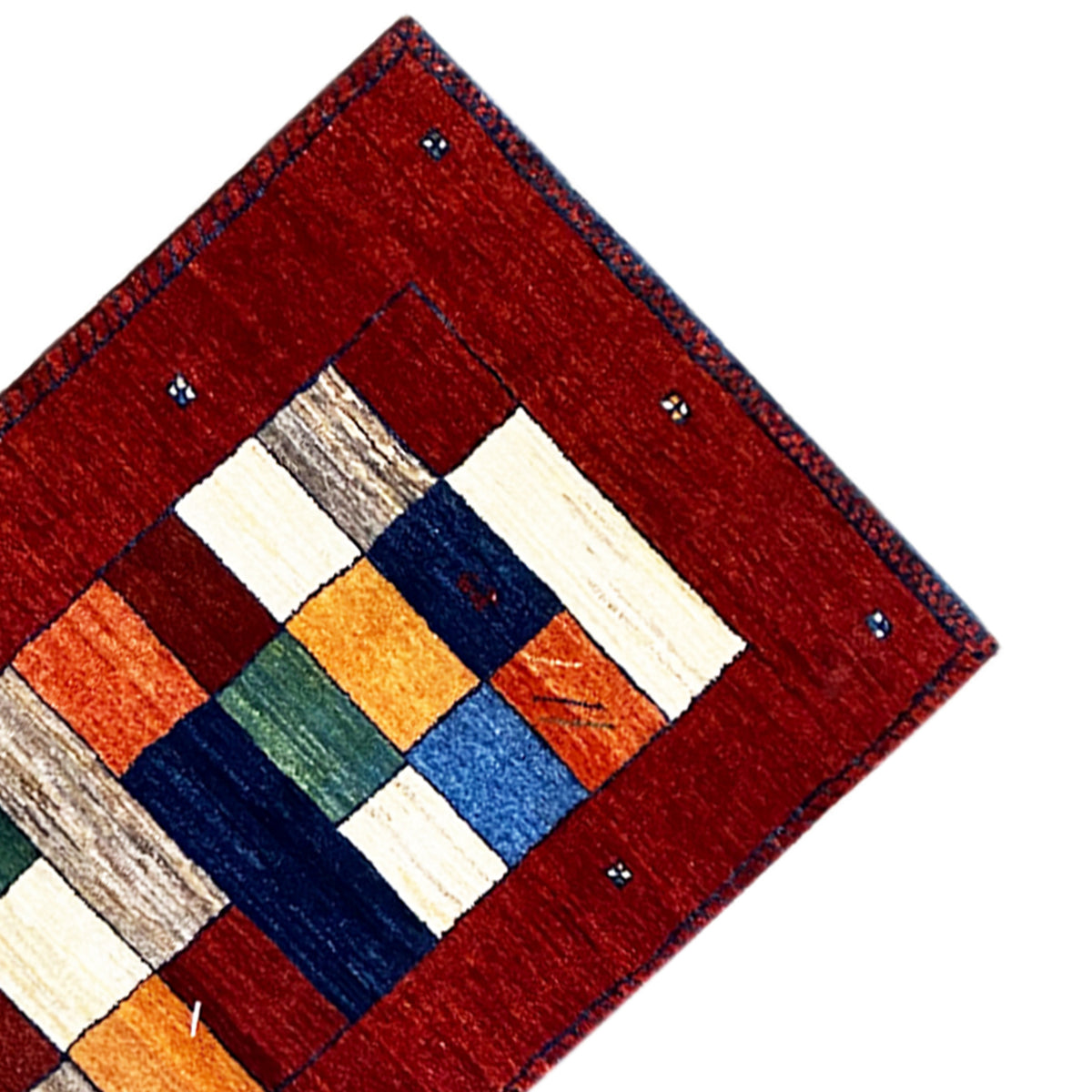 Gabbeh rug runner corner: red border with an inner motif of blue and beige squares