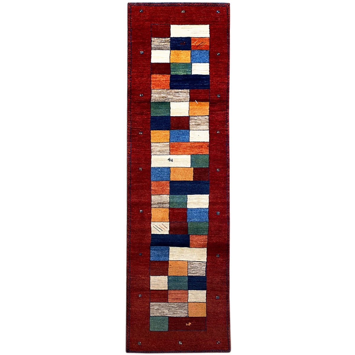 Gabbeh rug runner with a red background and a geometric square pattern in blue, green, and beige