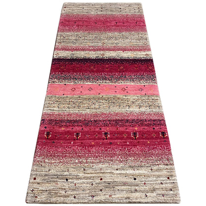 Landscape gabbeh rug runner with red and beige stripes, visible patterns