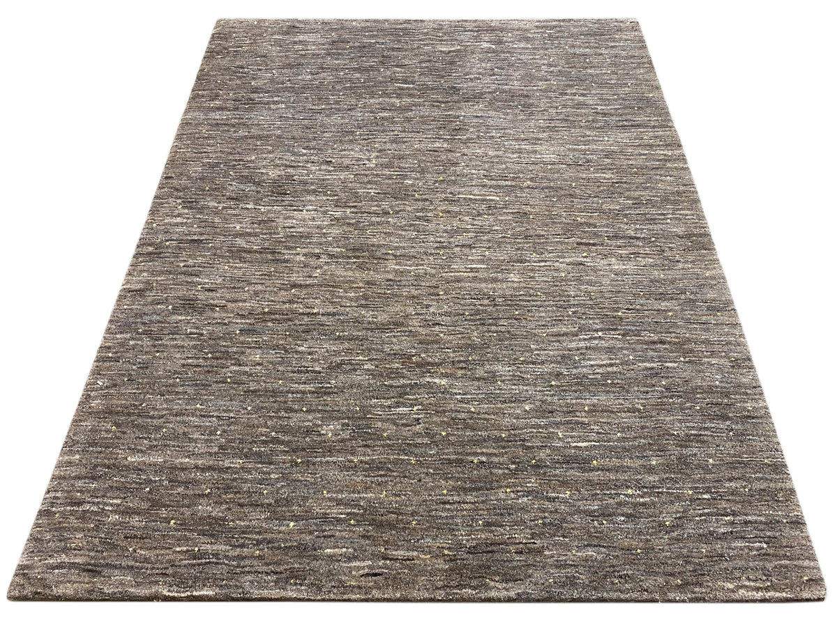 Rug in mottled dark and light gray, with fine gold-colored speckles.