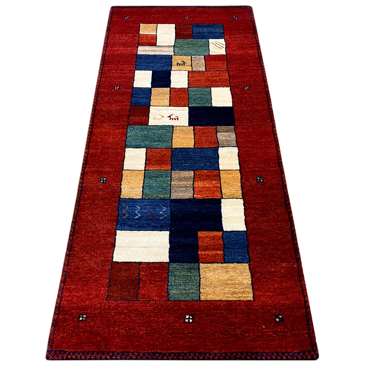 Gabbeh rug runner, red with geometric tiles in blue, green and beige, wide border.