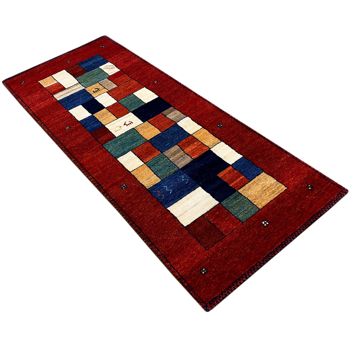 Gabbeh runner rug in an angled view: red background, tile pattern in blue, beige, and green.