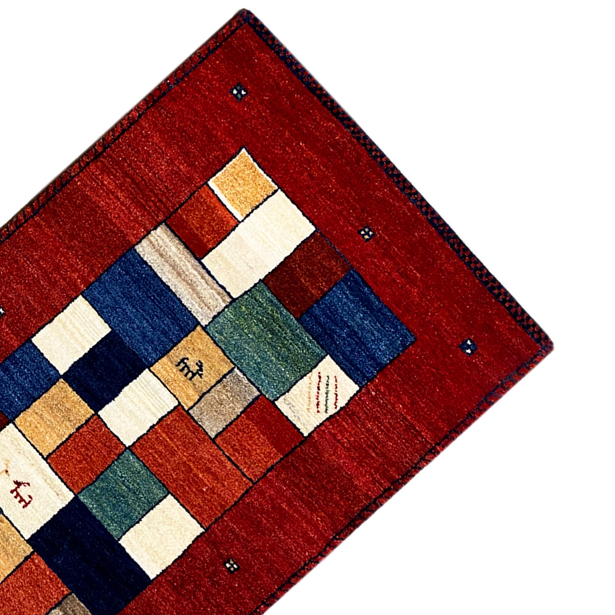 Gabbeh runner rug corner in view: red background with white and blue tiles.