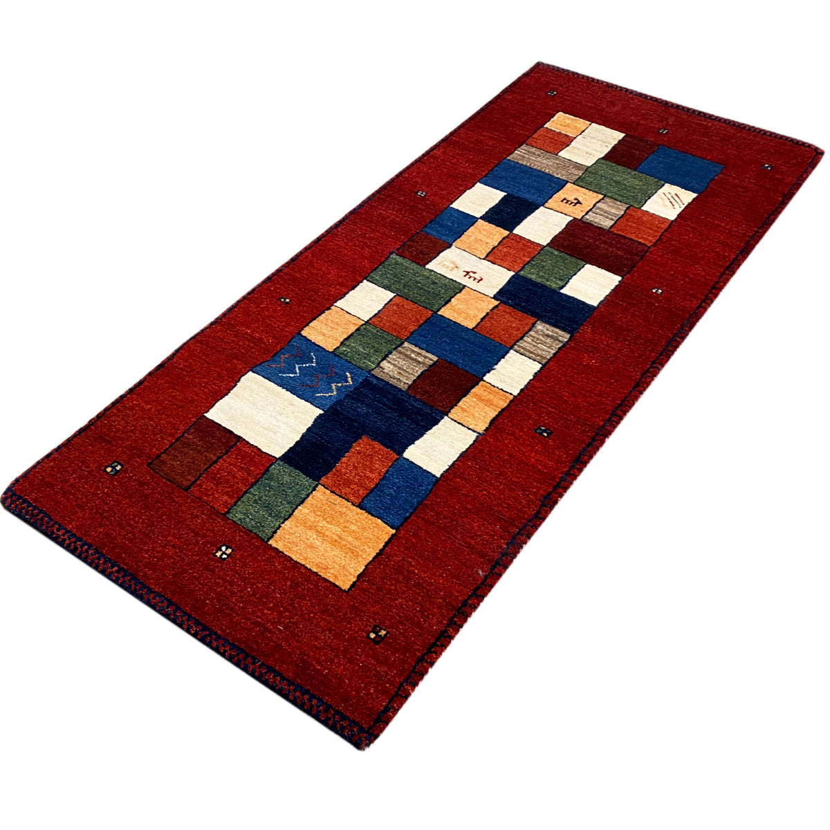 Red Gabbeh rug runner in landscape format with multicolored square and line patterns.