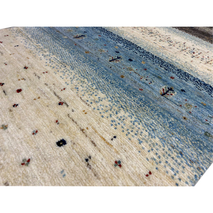 Close-up of a Gabbeh runner rug: fine weave with dots and light blue stripes