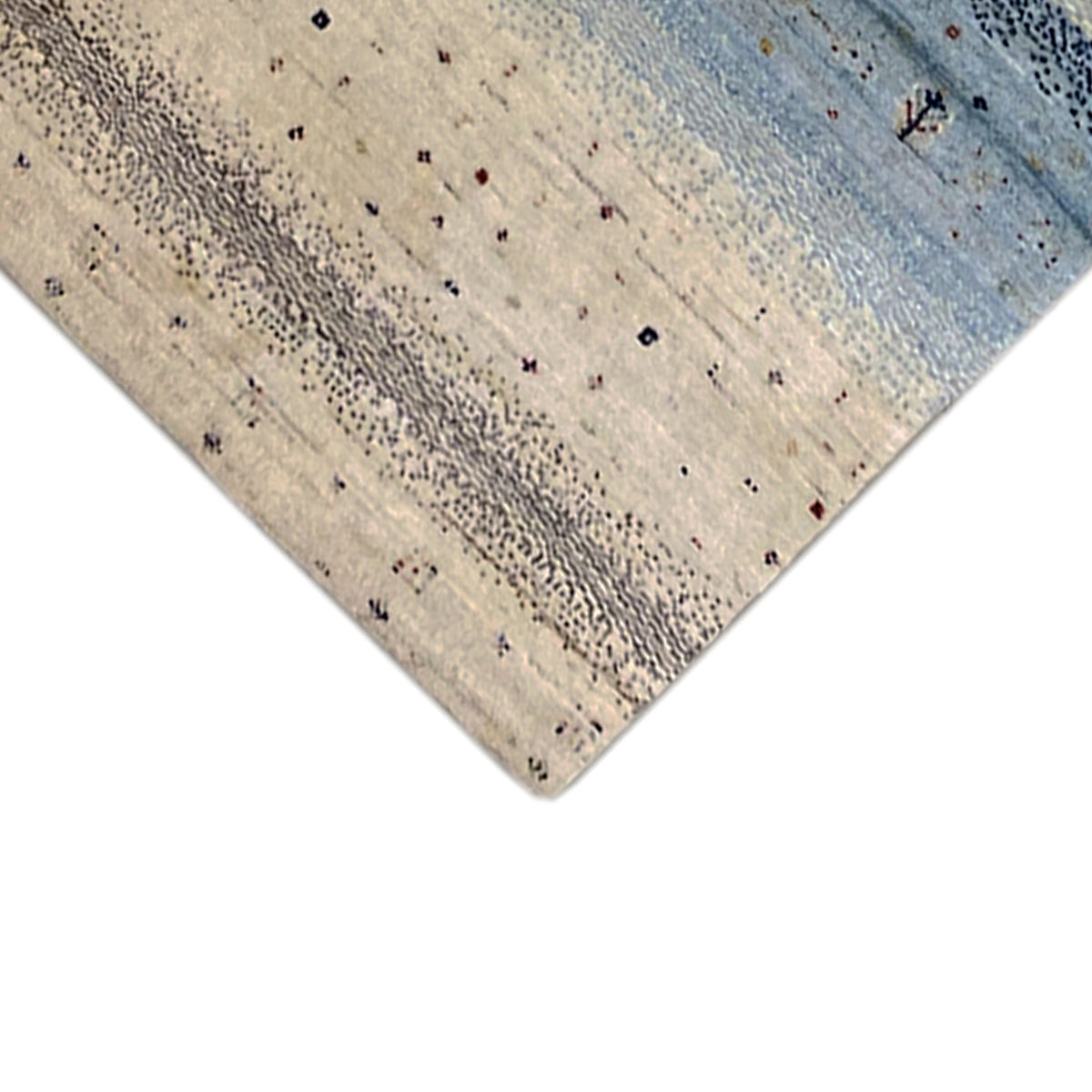 Gabbeh runner rug detail at the corner: beige field with colorful dots in the pattern
