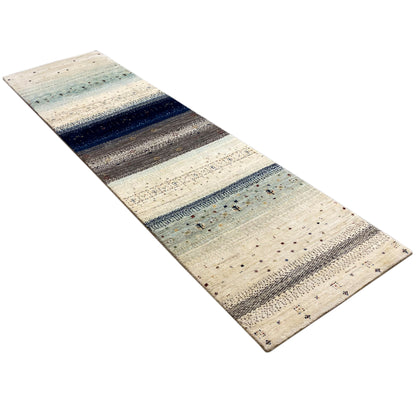 Gabbeh rug runner at an angle, cream with distinctive blue and gray stripes, fine dot motifs