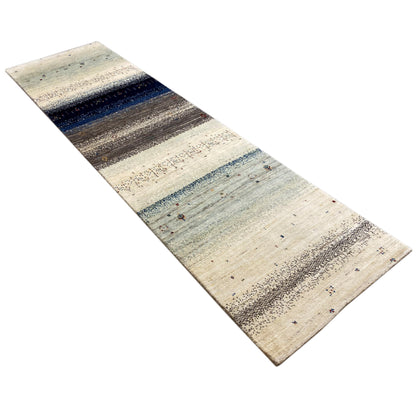 Gabbeh rug runner rolled out diagonally, beige design with blue and dark stripes