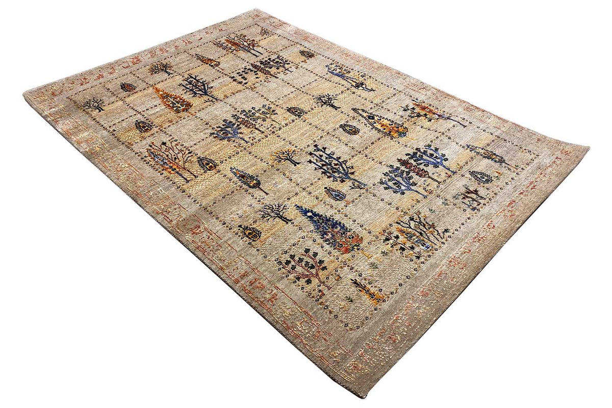 Oriental rug with a diagonal pattern, beige background, and blue tree motifs