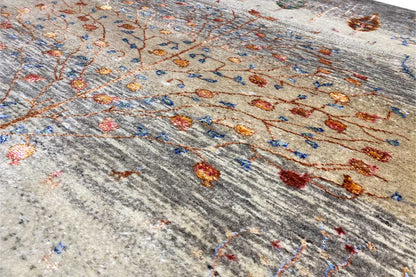 Gabbeh-Lori rug detail: flat gray weave with an orange and blue pattern.