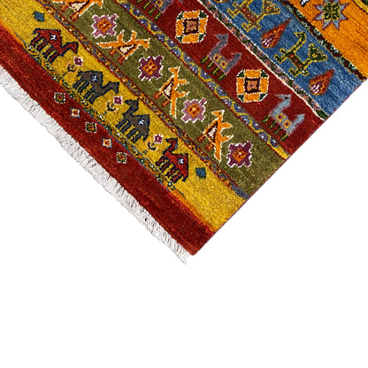 Gabbeh rug with border and ornaments, shades of red and blue, fringes along the edge