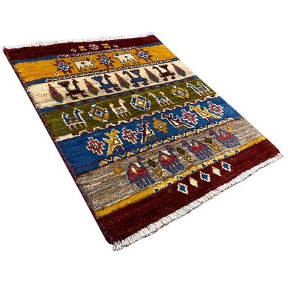 Gabbeh rug Lori 65×56 cm, diagonal view, multicolored ornamental bands with figures