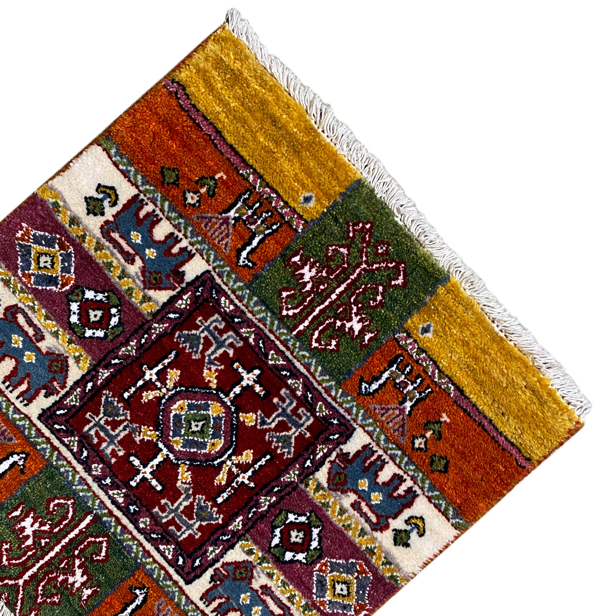 Colorful Gabbeh rug corner with border, ornaments, and white fringes