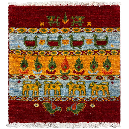 Gabbeh Lori carpet 61x58 cm front view: decorative border pattern, fringes, red-blue-yellow