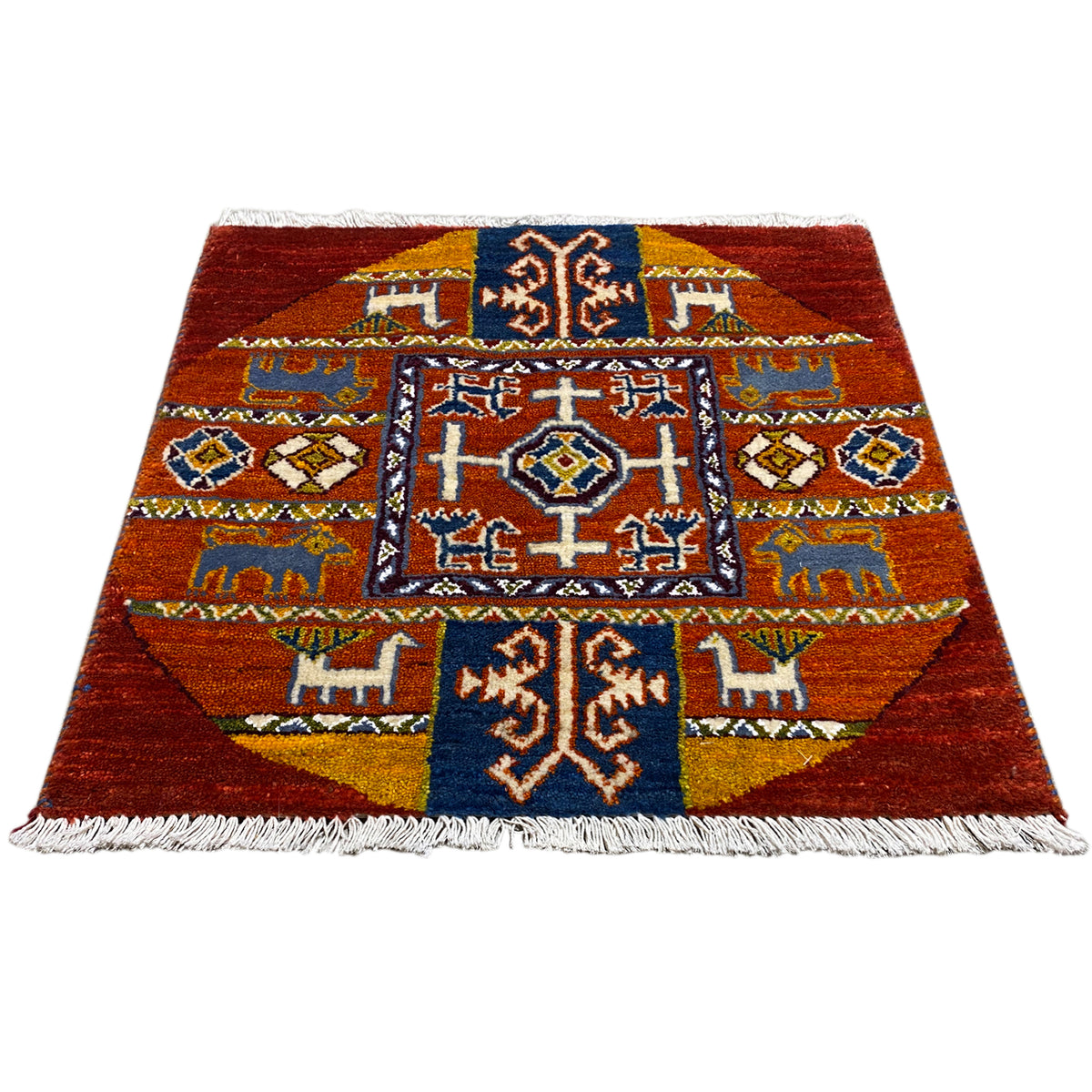 Gabbeh rug with a red background, medium-sized pattern and fringes, blue and white accents.