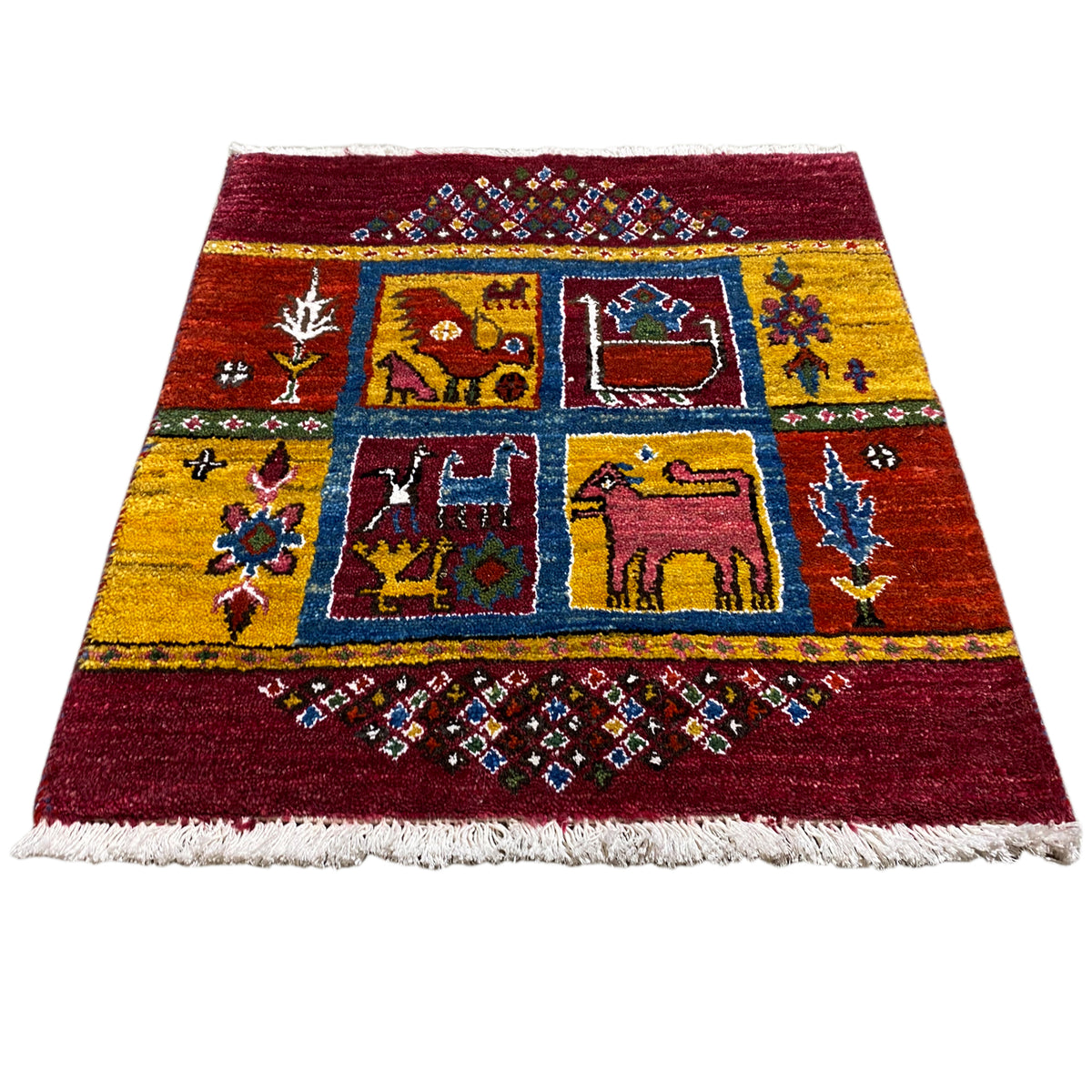 Gabbeh rug, wine red with yellow-blue animal and medallion motifs, fringes