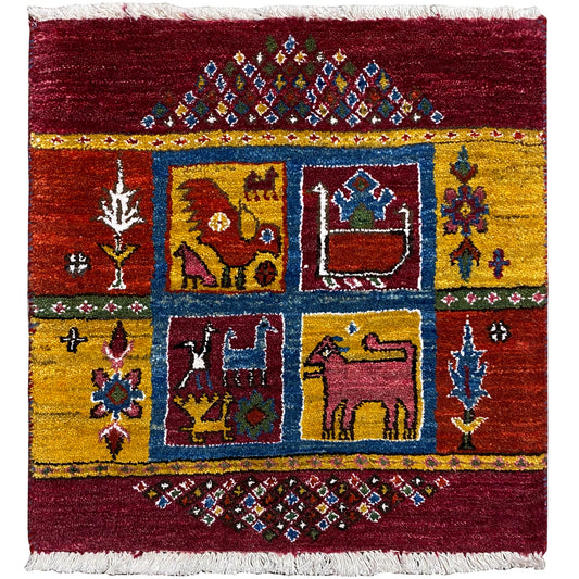Gabbeh rug with a colorful medallion pattern, burgundy and yellow, fringes