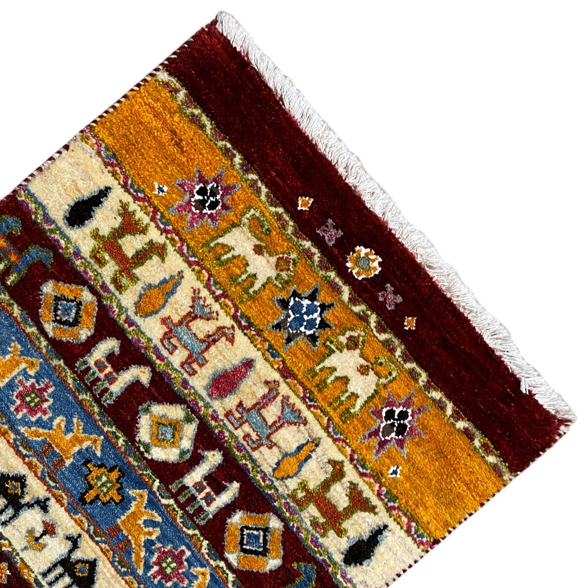 Gabbeh rug 63x58 cm, diagonal view with a colorful pattern and fringed edge.