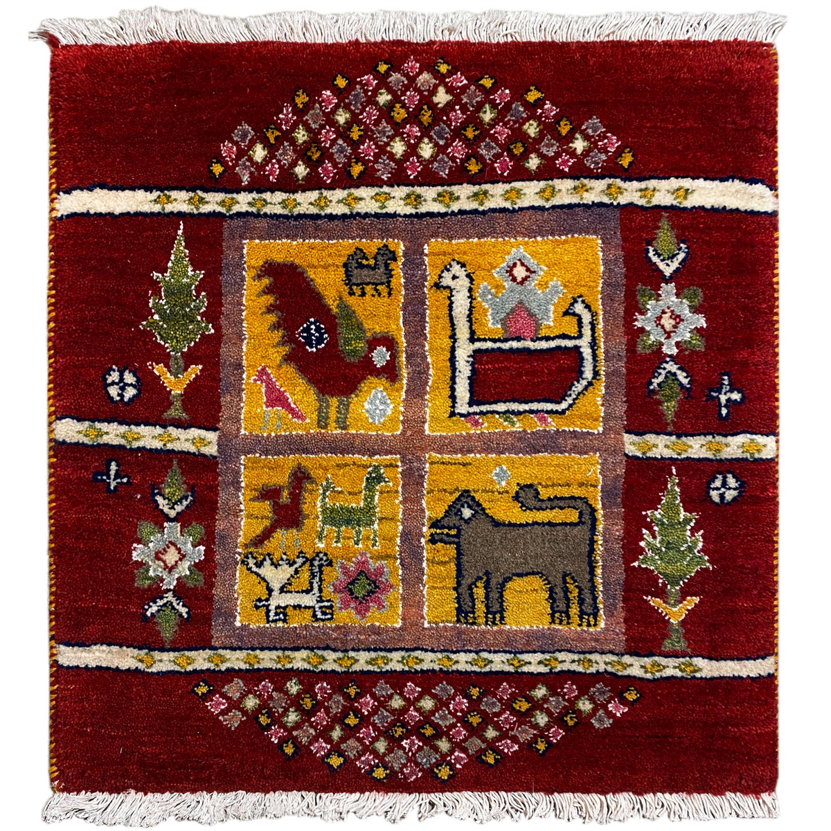 Gabbeh Lori rug front view: red field with a yellow-blue corner pattern and a white fringed border