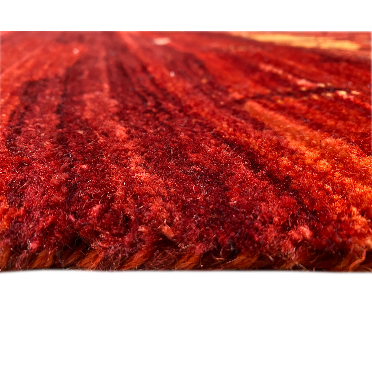 Carpet detail with dense red pile and an even texture, close-up