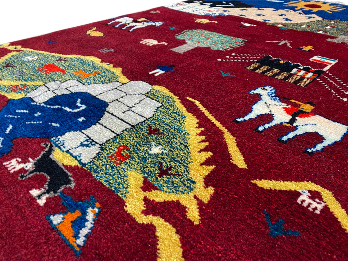Gabbeh-Luri rug detail: blue figures and animals in the red woven pattern