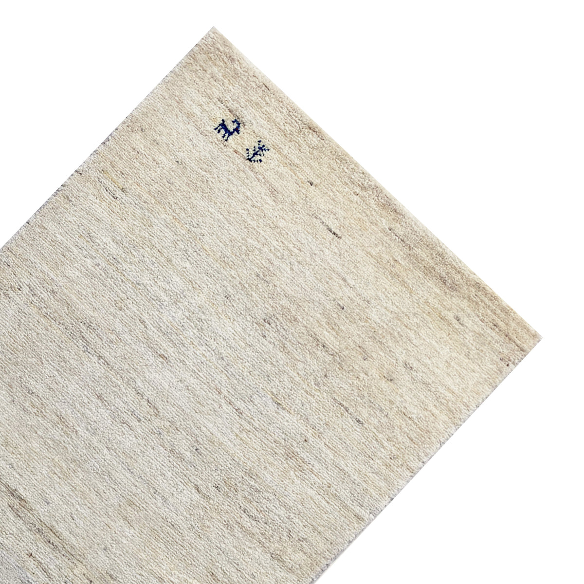 Gabbeh rug corner with a light beige pile and dark blue animal motifs