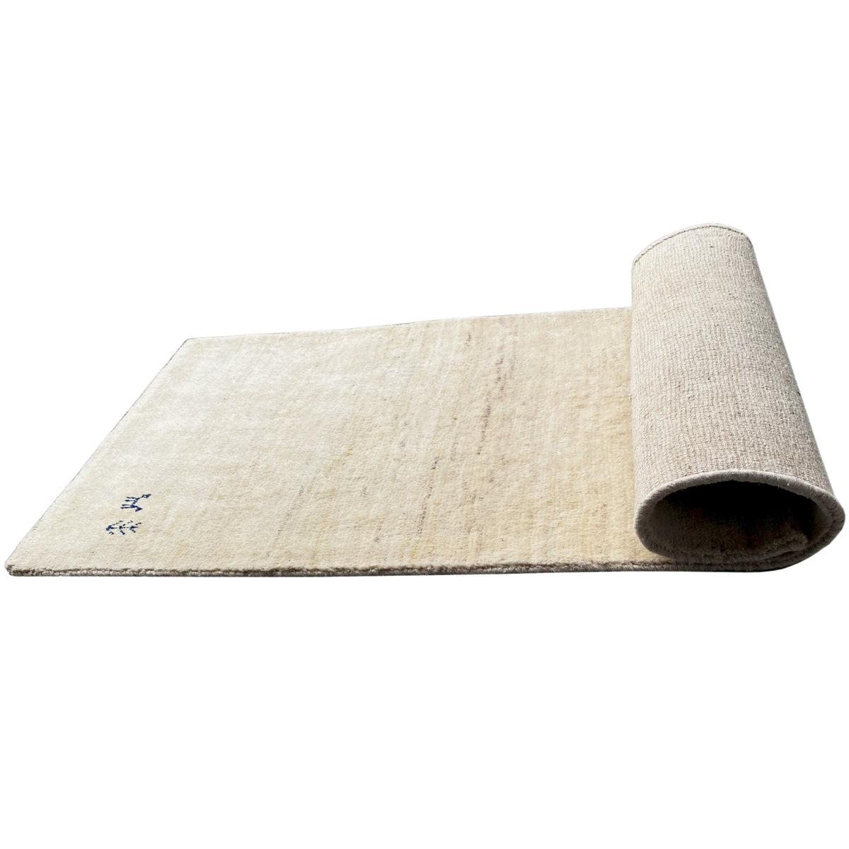 Gabbeh rug rolled up sideways, beige pile and back with a short edge