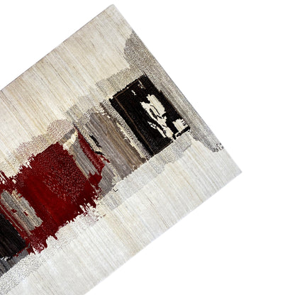 Corner view of the Gabbeh rug with an abstract square in black and red on a light background