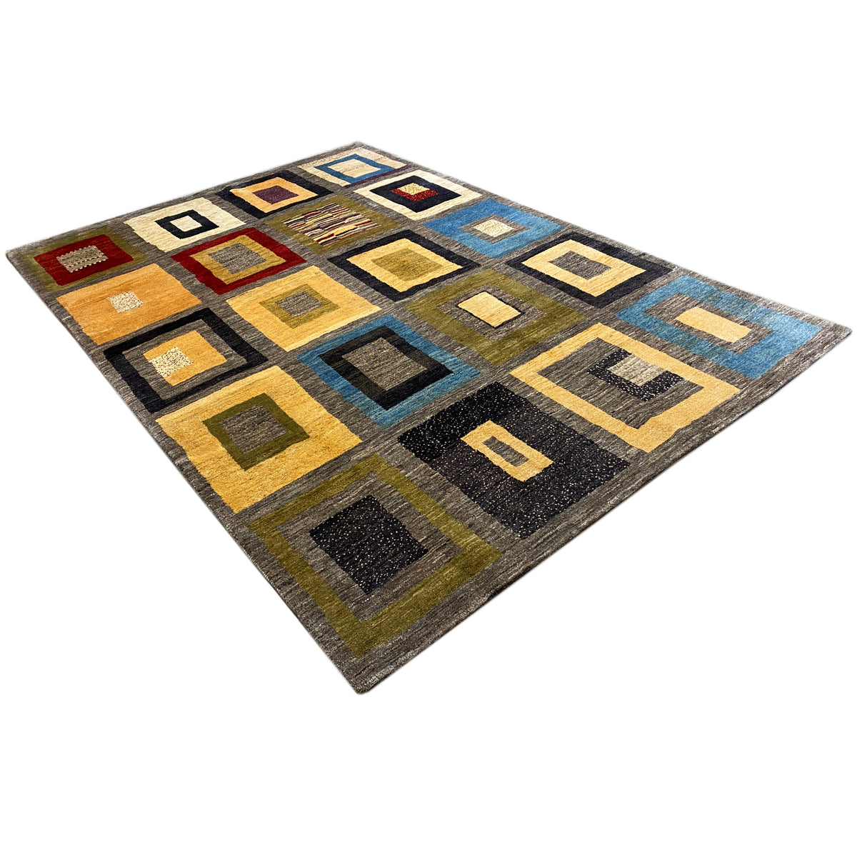Rug with a square patchwork design in gray, yellow, and blue