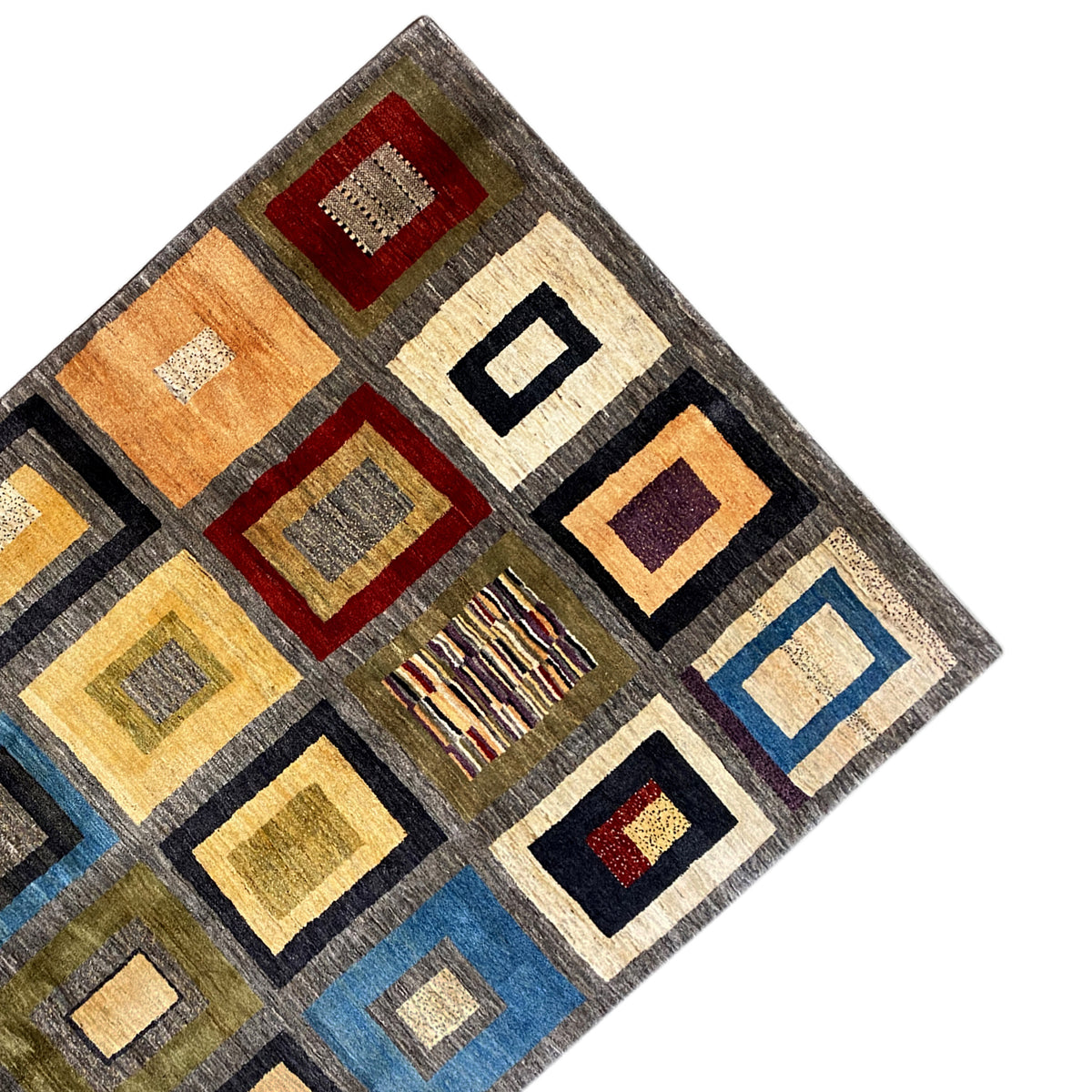 Carpet detail: geometric squares, gray with yellow, blue, and red accents