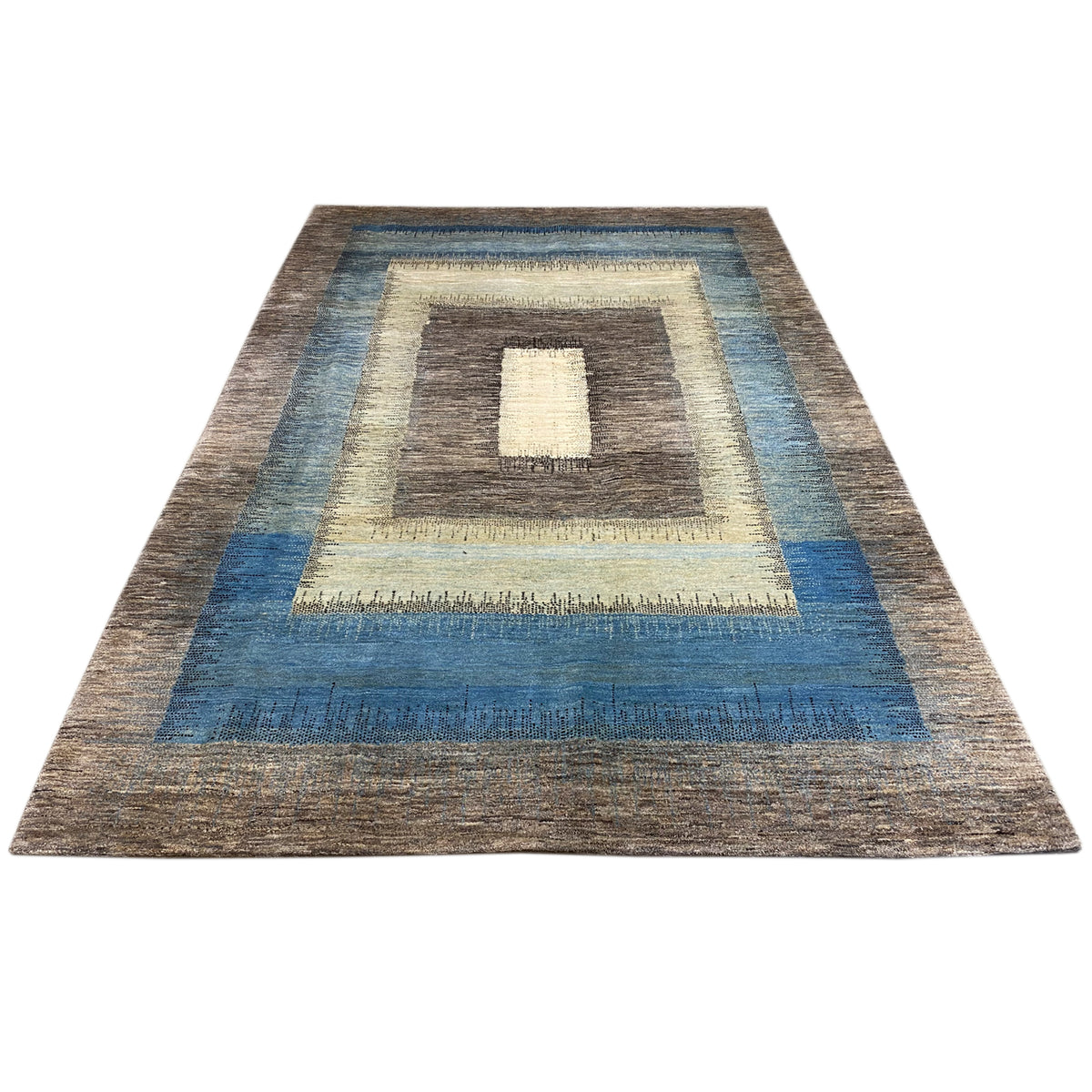 Rectangular Gabbeh rug with broad blue accents and a central motif