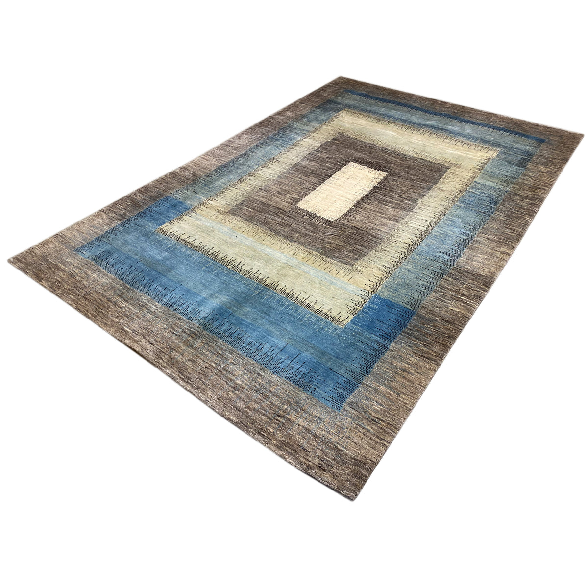 Gabbeh rug with a zoned pattern and a light square in the center