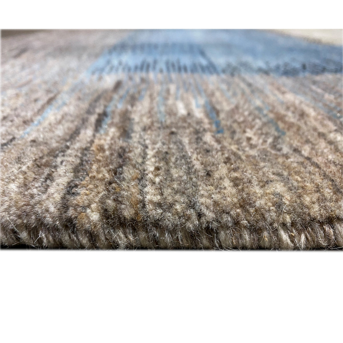 Gabbeh rug with a visible pile texture and dense edge finish