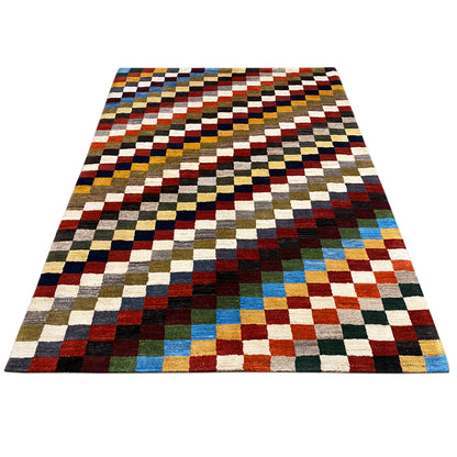 Gabbeh rug, rectangular, checked patchwork look in red, blue, yellow, and green.