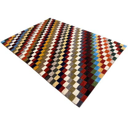 Gabbeh rug, diagonal view, geometric checkered pattern in many colors.